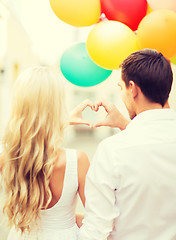 Image showing couple with colorful balloons