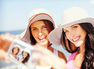 Image showing girls taking self portrait on the beach