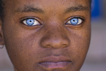 Image showing Black girl, blue eyes