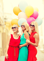 Image showing beautiful girls with colorful balloons in the city