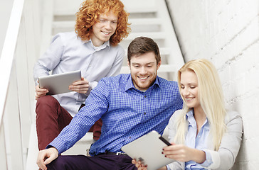 Image showing team with tablet pc computer sitting on staircase