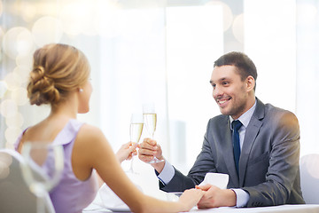 Image showing couple with glasses of champagne at restaurant