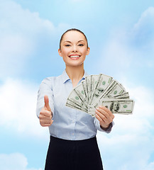 Image showing young businesswoman with dollar cash money