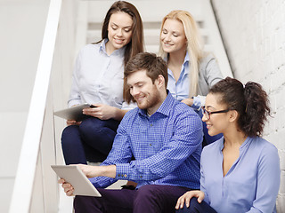 Image showing team with tablet pc computer sitting on staircase