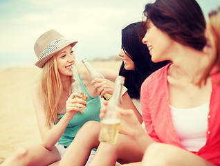 Image showing girls with drinks on the beach