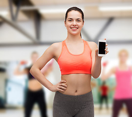 Image showing sporty woman with smartphone