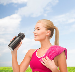 Image showing sporty woman with special sportsman bottle