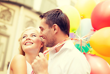 Image showing happy couple with colorful balloons