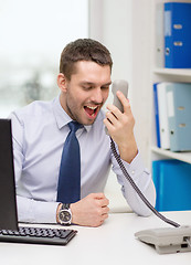 Image showing screaming businessman or student with computer