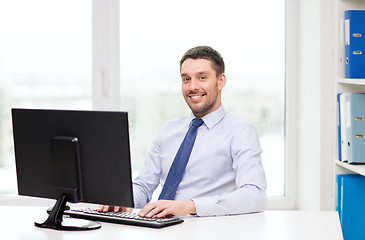 Image showing smiling businessman or student with computer