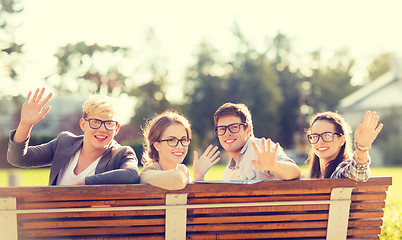 Image showing group of students or teenagers waving hands