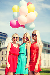 Image showing beautiful girls with colorful balloons in the city