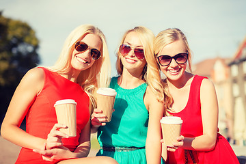 Image showing women with takeaway coffee cups in the city