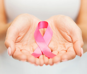 Image showing hands holding pink breast cancer awareness ribbon