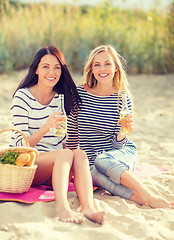 Image showing girls with drinks on the beach