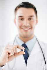 Image showing doctor with pill in hospital