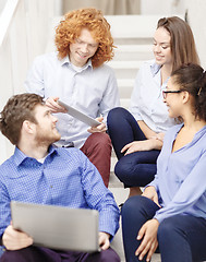 Image showing team with laptop and tablet pc on staircase