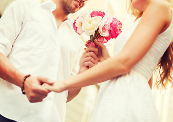 Image showing couple with flowers in the city