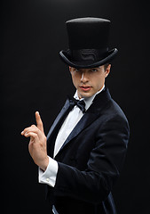 Image showing magician in top hat showing trick