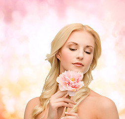 Image showing lovely woman with peony flower