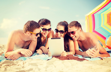 Image showing group of smiling people with tablet pc on beach