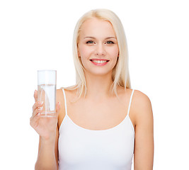 Image showing young smiling woman with glass of water