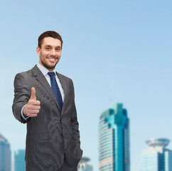 Image showing handsome buisnessman showing thumbs up