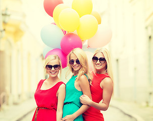 Image showing beautiful girls with colorful balloons in the city