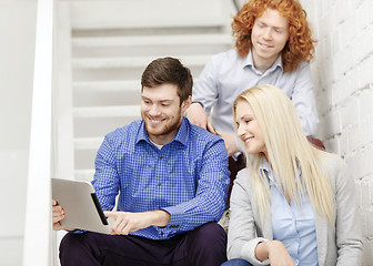 Image showing team with tablet pc computer sitting on staircase