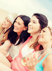 Image showing girls with drinks on the beach