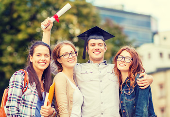 Image showing students or teenagers with files and diploma