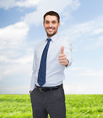 Image showing handsome businessman showing thumbs up