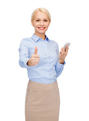 Image showing young smiling businesswoman with smartphone