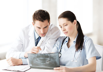 Image showing two doctors looking at x-ray