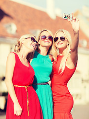 Image showing beautiful girls taking picture in the city