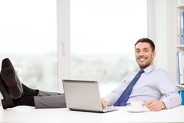 Image showing smiling businessman or student with laptop