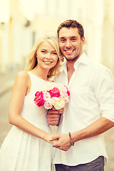 Image showing couple with flowers in the city