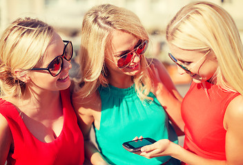 Image showing beautiful girls with smartphone in the city