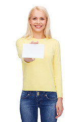 Image showing smiling girl with blank business or name card