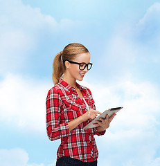 Image showing smiling girl in eyeglasses with tablet pc computer