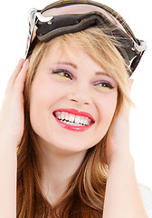 Image showing smiling teenage girl in snowboard goggles