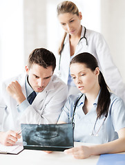 Image showing group of doctors looking at x-ray