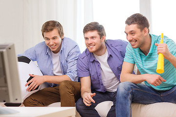 Image showing happy male friends with football and vuvuzela