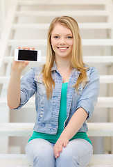 Image showing smiling student with smartphone blank screen