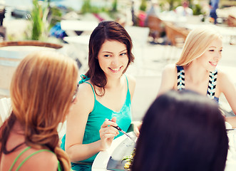 Image showing girls in cafe on the beach