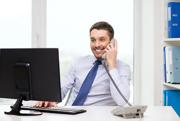 Image showing smiling businessman or student with computer