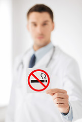 Image showing male doctor holding no smoking sign