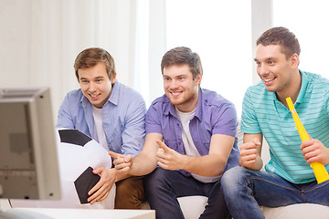 Image showing happy male friends with football and vuvuzela