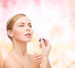 Image showing beautiful woman with lipgloss