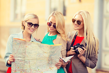 Image showing beautiful women with tourist map in the city